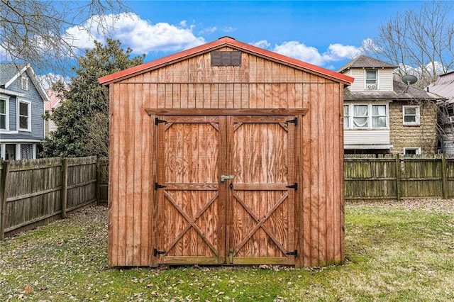 view of outbuilding featuring a yard