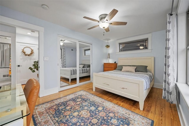 bedroom with hardwood / wood-style flooring and ceiling fan