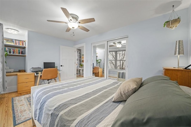 bedroom with ceiling fan and light hardwood / wood-style floors