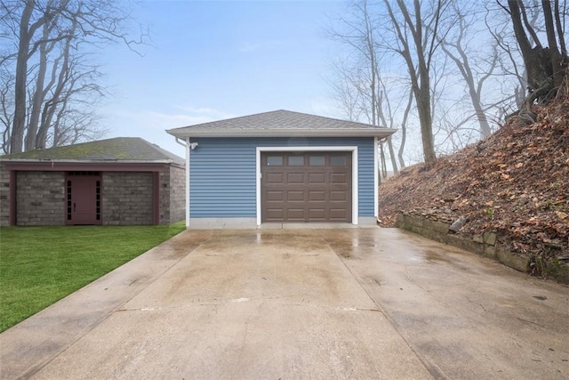 garage featuring a yard