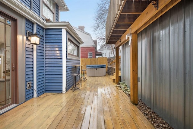 wooden terrace with a hot tub