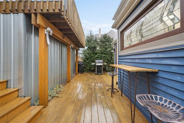 wooden terrace with grilling area