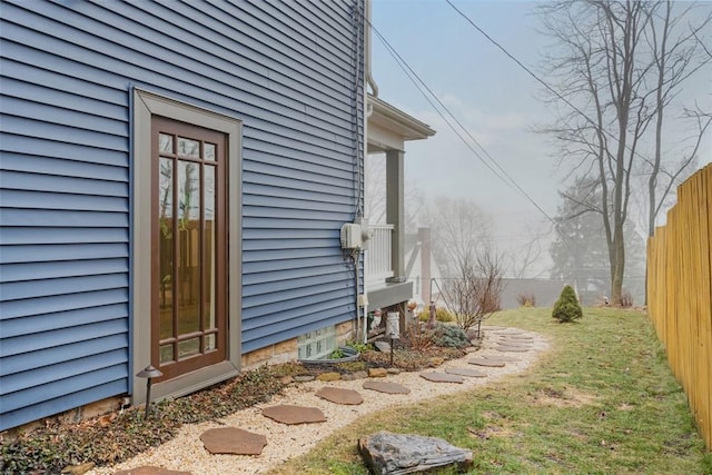 view of home's exterior with a lawn