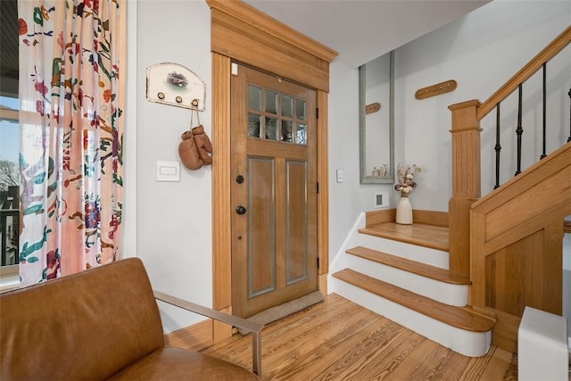 foyer entrance with light hardwood / wood-style flooring