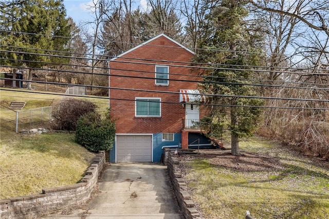 exterior space with a garage and a front yard