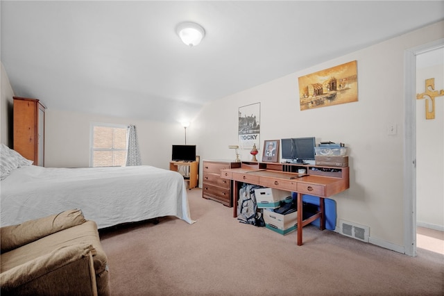 bedroom with light carpet and lofted ceiling