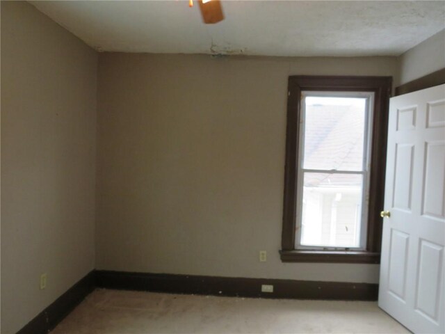 unfurnished room with ceiling fan