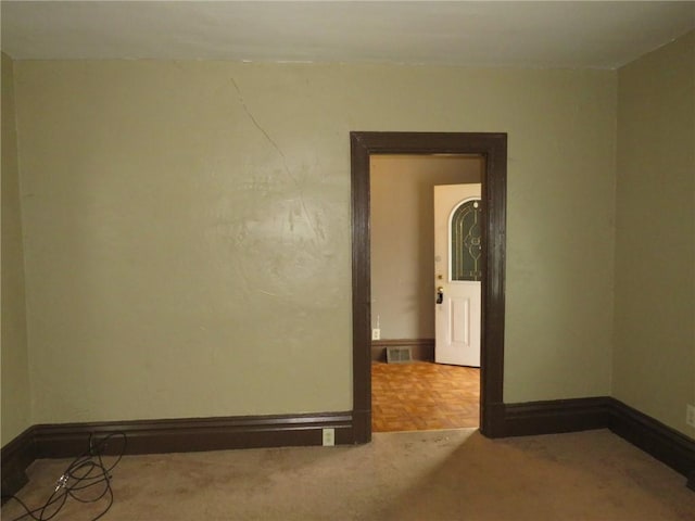 empty room with parquet flooring