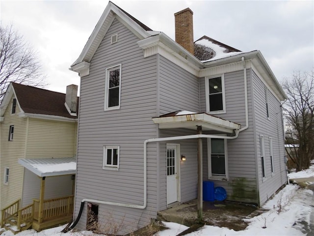 view of snow covered house