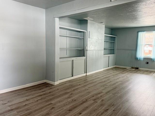 unfurnished bedroom featuring dark wood-type flooring