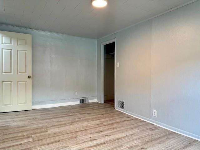 unfurnished room featuring light wood-type flooring