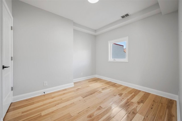 spare room with light hardwood / wood-style floors