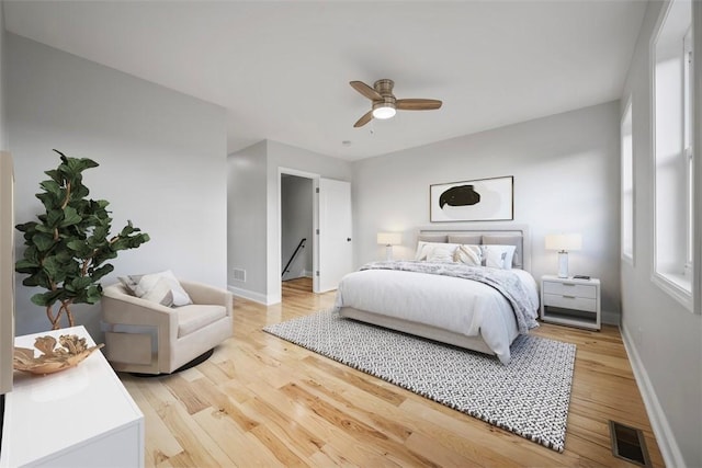 bedroom with hardwood / wood-style flooring and ceiling fan