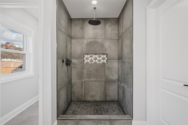 bathroom featuring a tile shower