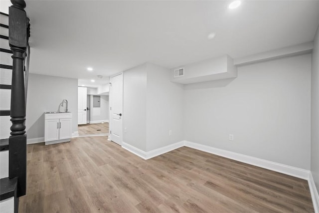 basement with light wood-type flooring