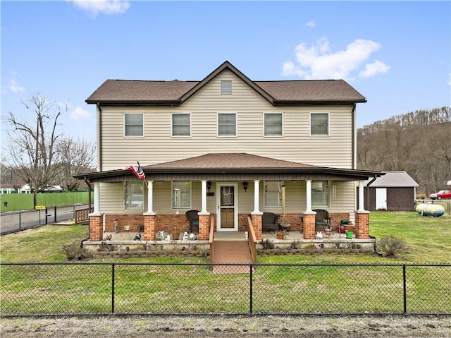 view of front of property with covered porch and a front lawn