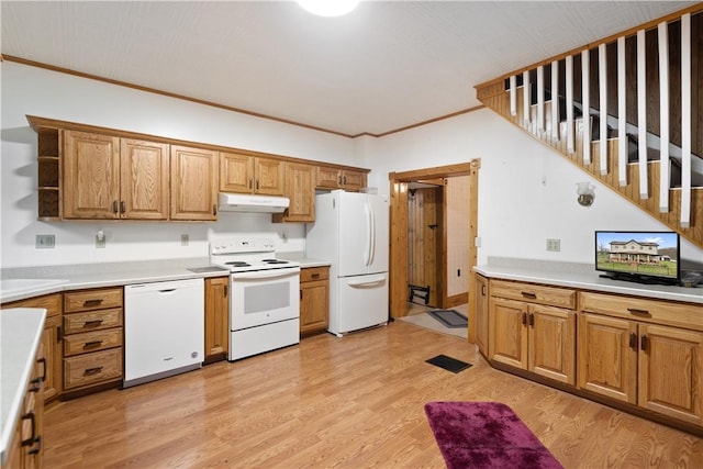 kitchen featuring white appliances, ornamental molding, and light hardwood / wood-style floors