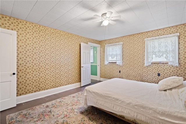 bedroom featuring dark hardwood / wood-style floors and ceiling fan