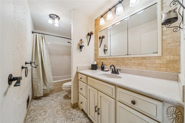 full bathroom with vanity, toilet, and shower / bath combo