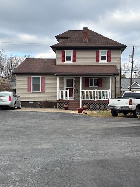 front facade featuring covered porch