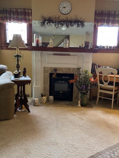 sitting room featuring carpet floors and a tile fireplace