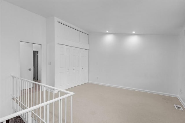 interior space with a closet and carpet flooring