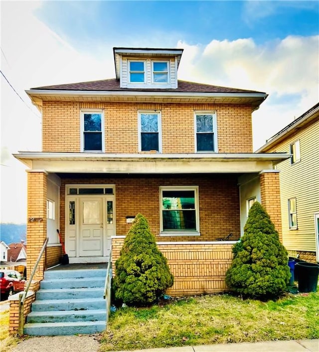 view of front of property featuring covered porch