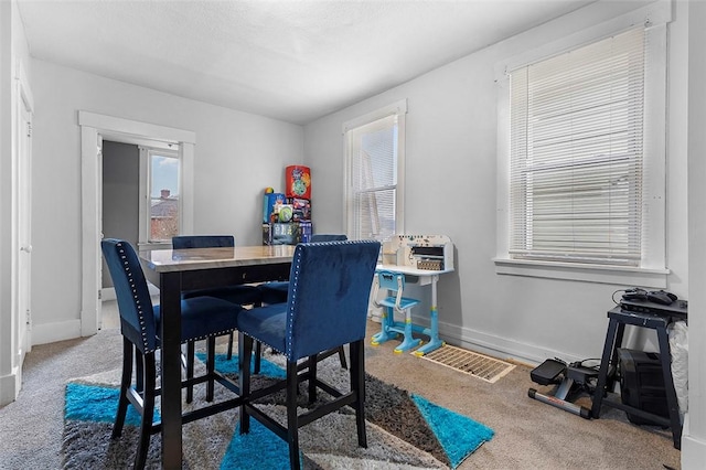 view of carpeted dining space