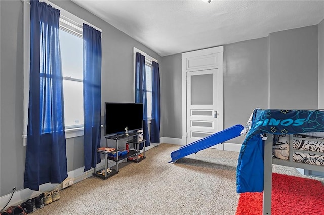 game room with a textured ceiling