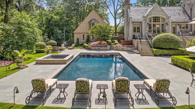 134 S Dr, Fox Chapel, PA 15238 - swimming pool featuring stairway, a patio area, and an in-ground hot tub