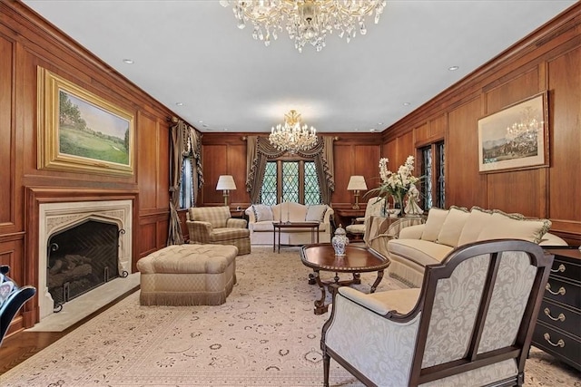 134 S Dr, Fox Chapel, PA 15238 - living room with a chandelier, wooden walls, ornamental molding, and a fireplace