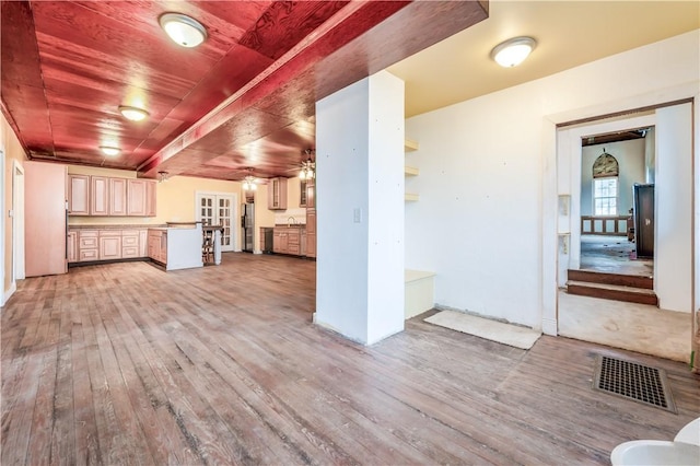 kitchen featuring stainless steel fridge with ice dispenser, wood ceiling, ceiling fan, and light wood-type flooring