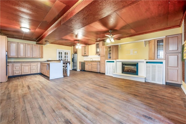 kitchen featuring sink, wooden ceiling, light wood-type flooring, ceiling fan, and stainless steel appliances