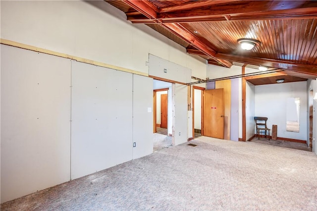 basement featuring carpet and wooden ceiling