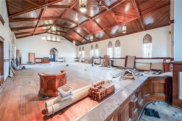 misc room with wood-type flooring, a wealth of natural light, wooden ceiling, and high vaulted ceiling