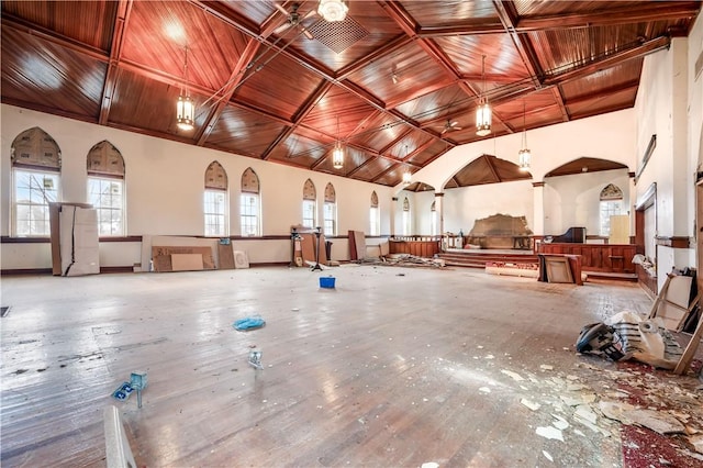 miscellaneous room featuring high vaulted ceiling and wooden ceiling