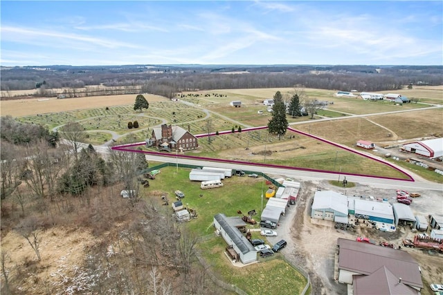 birds eye view of property featuring a rural view