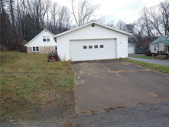 garage with a lawn