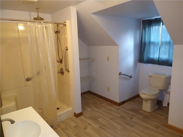 bathroom with sink, a shower with curtain, and hardwood / wood-style flooring