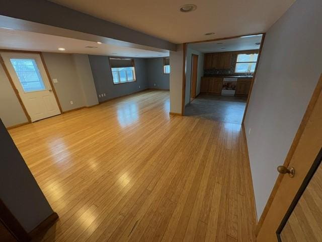 unfurnished living room with light hardwood / wood-style floors