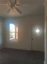 spare room with ceiling fan