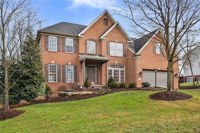 front of property with a garage and a front lawn