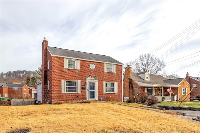 view of front of property with a front lawn and covered porch