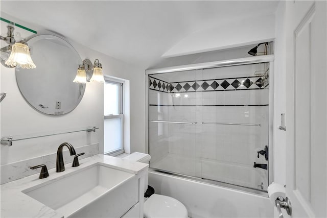 full bathroom with vanity, toilet, and combined bath / shower with glass door