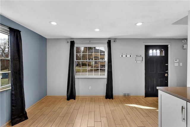 foyer featuring light hardwood / wood-style floors