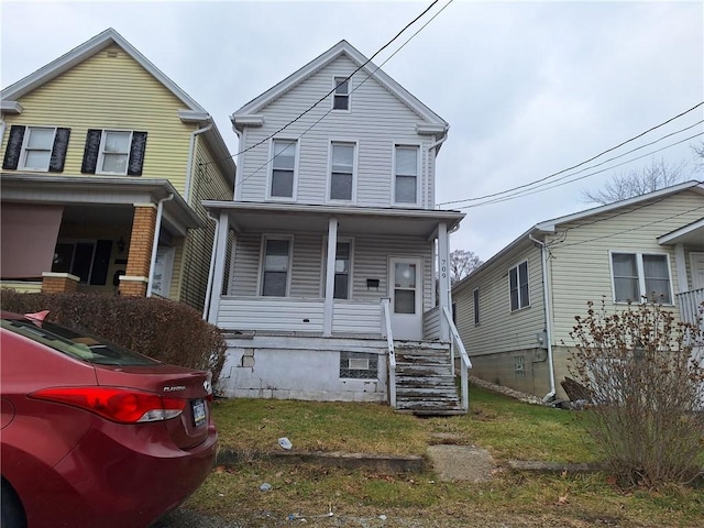 view of front property featuring covered porch