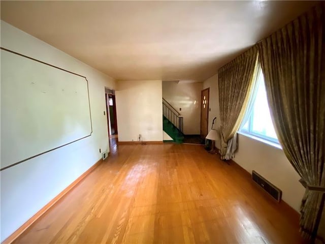 empty room featuring hardwood / wood-style flooring