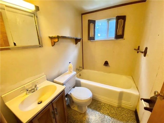 bathroom with vanity, a bathing tub, and toilet