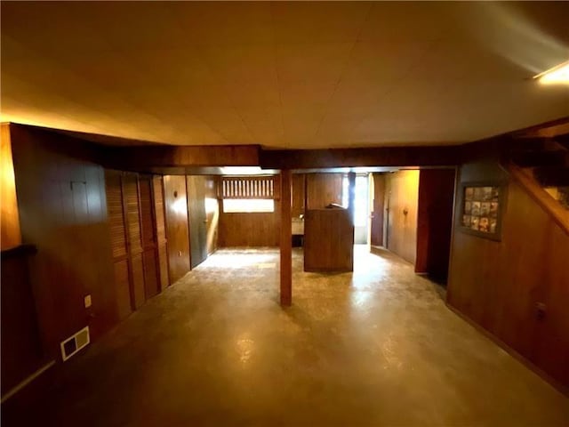 basement with wooden walls