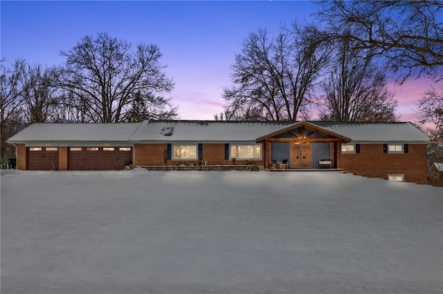 ranch-style home featuring a garage